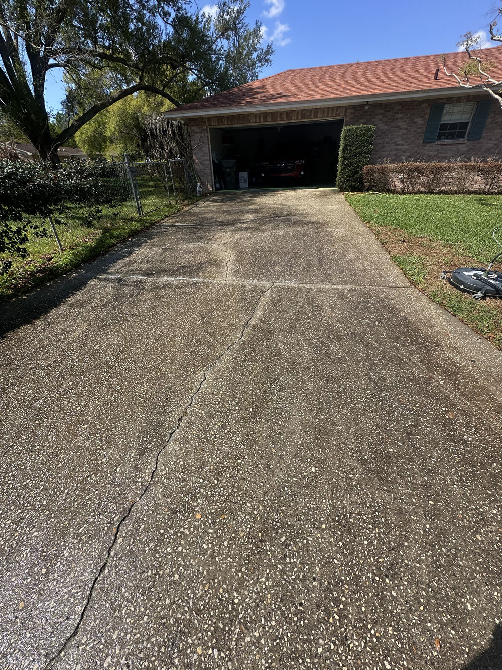 Driveway pressure washing with surface-cleaning equipment