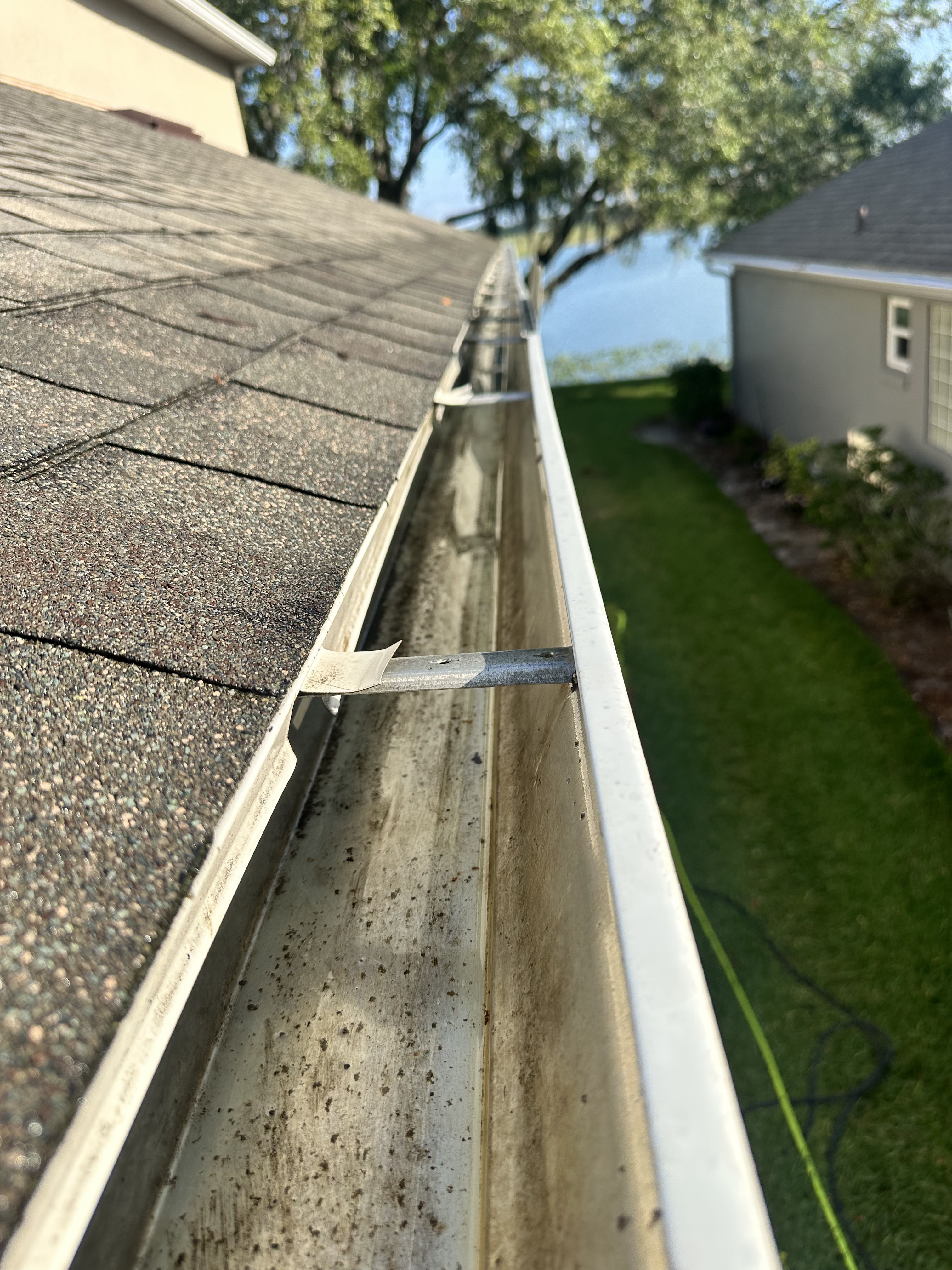 Clean gutter channel along a roofline